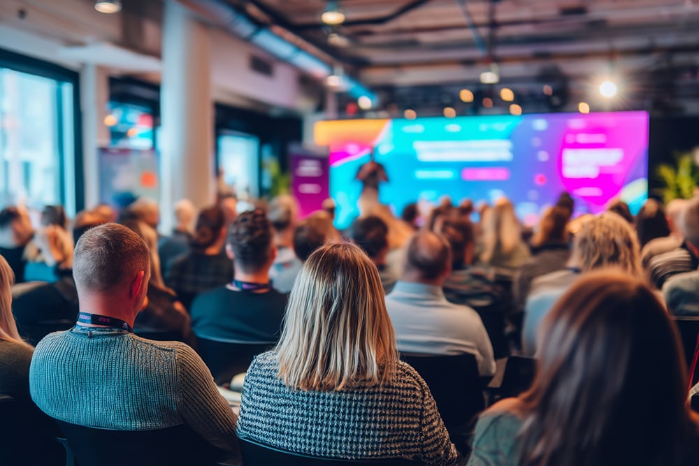 Large group meeting with presenter
