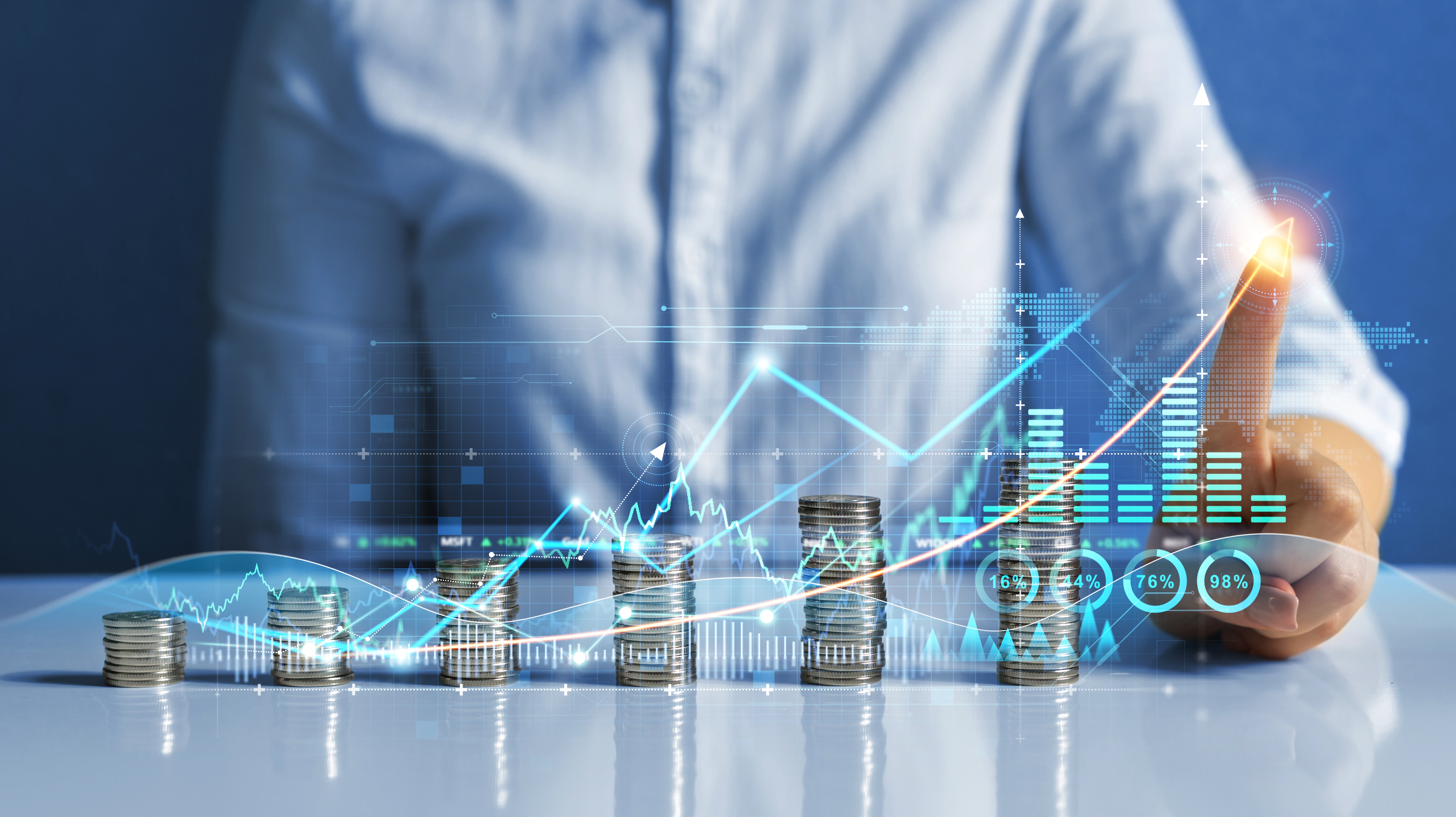 Person sitting at a desk with an animation of a chart in front