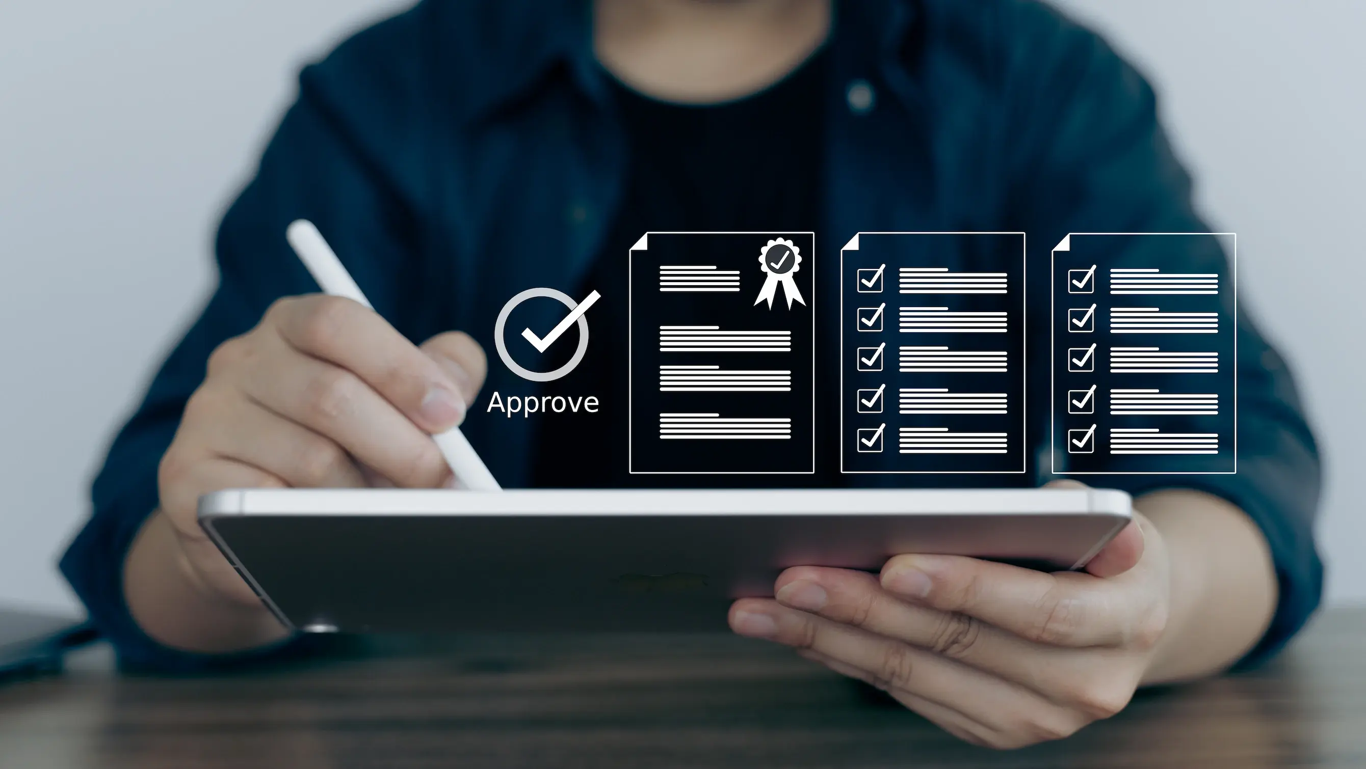 A person writing on their tablet with a superimposed image of them completing tasks and getting approval implies what they are doing.